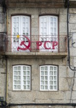 Hammer and sickle sign on PCP Portuguese Communist Party building, city centre Guimaraes. Portugal