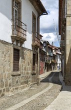 Street of historic buildings with balconies, Rua João Lopes de Faria, city centre Guimaraes,