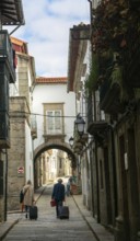 Narrow medieval street Rua de Santa Maria, city centre of Guimaraes, northern Portugal