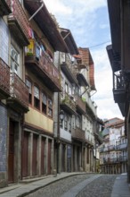 Street of historic buildings with balconies, Rua Egas Montiz, city centre Guimaraes, northern