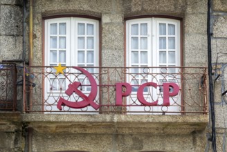Hammer and sickle sign on PCP Portuguese Communist Party building, city centre Guimaraes. Portugal