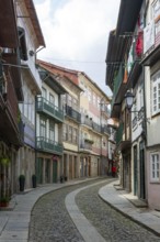 Street of historic buildings with balconies, Rua Egas Montiz, city centre Guimaraes, northern