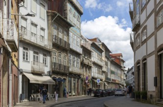 Shops in historic buildings, Rua de Santa Antonio, city centre Guimaraes, northern Portugal