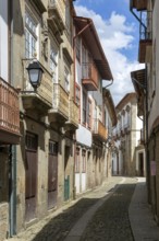 Street of historic buildings with balconies, Rua João Lopes de Faria, city centre Guimaraes,