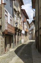 Street of historic buildings with balconies, Rua João Lopes de Faria, city centre Guimaraes,