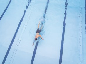Close-up of a swimmer in motion in a clear pool, Calw outdoor pool, Black Forest, Germany, Europe