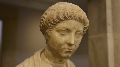 Classical marble bust of a man with antique hairstyles in rich detail, Age of Marcus Aurelius,