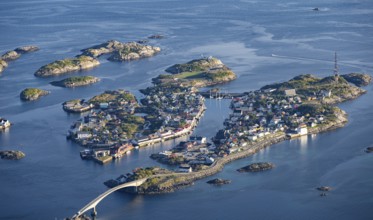 Houses on small rocky islands in the sea, view of Henningsvær, Vågan, Lofoten, Nordland, Norway,