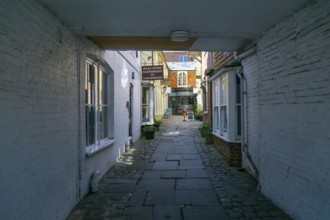 Specialist shops in Old Hughenden Yard alleyway, Marlborough, Wiltshire, England, UK