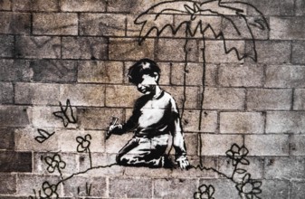 Banksy - Child paints himself a world of flowers, exhibition The World of Banksy
