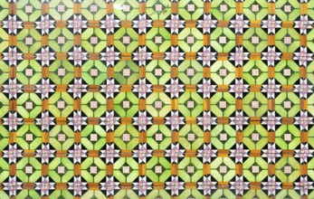 Bright colourful pattern of ceramic tiles on wall of house, Rua das Trinas, Guimaraes, northern