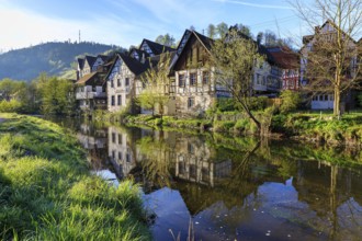 Historic half-timbered houses are reflected in the Kinzig, old town centre of Schiltach, Black