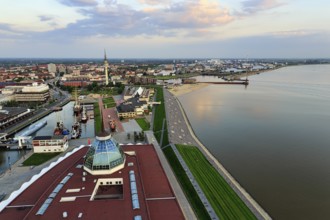 View from above of directional radio tower, shipping museum and Weser, evening sky, city centre,