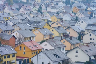 Roofs of a densely built-up settlement on a cloudy winter's day, Großheubach, Spessart, Bavaria,