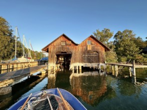 Boathouses on Lake Starnberg in the evening, Bavaria, Germany, Europe