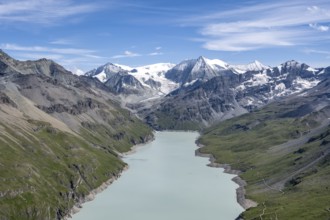 Blue mountain lake in a mountain landscape with glaciers, Lac des Dix reservoir and Mont Blanc de