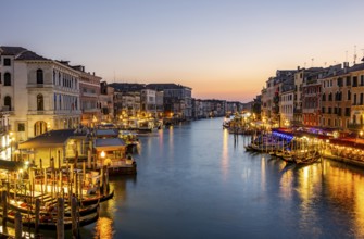 View of the Grand Canal at the blue hour, picturesque evening mood with illuminated palazzos on the