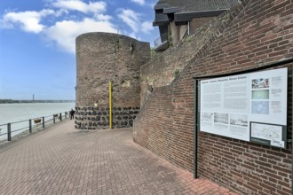 View of historic town wall and former customs tower for customs duties on the Rhine promenade of