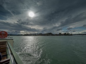 Dark clouds over the Chiemsee, view of the Fraueninsel, Bavaria, Germany, Europe
