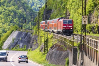 Regional express RE5 en route on the winding railway line of the Geislinger Steige. Landscape along