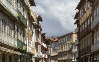 Historic medieval buildings in city centre, Rua Rainha Dona Maria I, Guimaraes, northern Portugal