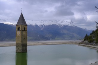 Bad weather at the church tower of Altgraun in Reschensee, Reschenpass, Vinschgau, South Tyrol,