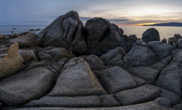 Sunset, rocky coast near Porto Pollo, Corsica, France, Europe