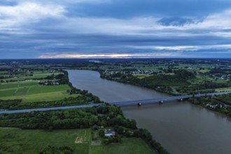 Twilight over bridge and filekds in Libourne from a drone, Gironde, Nouvelle-Aquitaine,