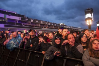 Festival visitors in front of the grandstand at the Rock am Ring Festival on Friday, Nürburgring