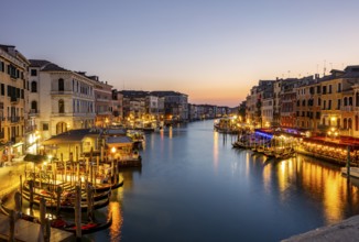 View of the Grand Canal at the blue hour, picturesque evening mood with illuminated palazzos on the