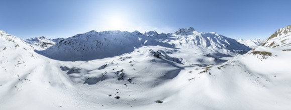 Alpine panorama, aerial view in winter, Alpine Club hut Kesch-Hütte in front of mountain peak Piz