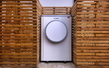 Bosch Compress 7400i AW air-to-water heat pump, logo, outdoor unit, building services, standing in