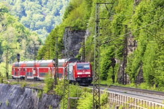 Regional express RE5 en route on the winding railway line of the Geislinger Steige. Landscape along