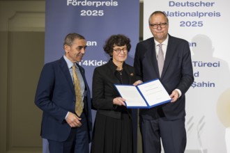 Ugur Sahin and Özlem Türeci (founders of Biontech SE) and Andreas Voßkuhle (President of the Senate