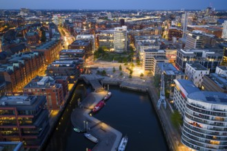 Aerial view of the Speicherstadt Hamburg with Magellan Terraces at Sandtor harbour at blue hour,