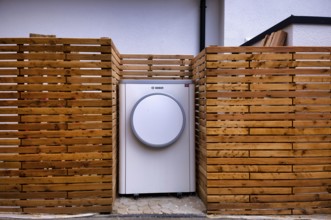 Bosch Compress 7400i AW air-to-water heat pump, logo, outdoor unit, building services, standing in