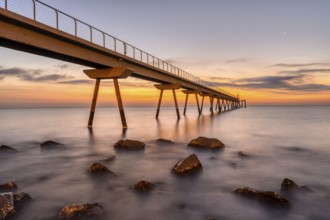 The pier of Badalona in Spain in front of sunrise