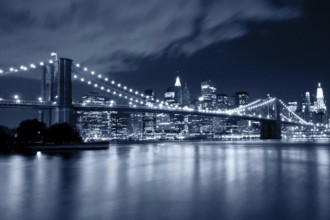 Brooklyn Bridge at night in blue cold tint