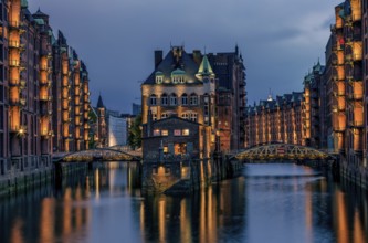 View of the Speicherstadt at night in Hamburg, Germany. Illuminated Speicherstadt seen from the