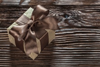 Brown gift box on vintage wooden board