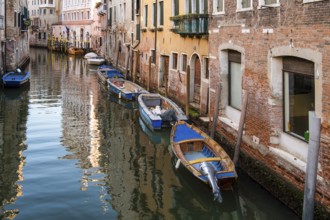 Idyllic canals with boats, between residential houses, Venice, Veneto, Italy, Europe