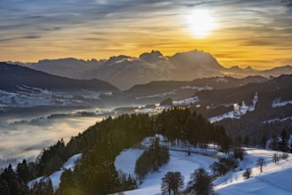 Dreamlike winter landscape at sunset with a view from the Allgäu Alps over the Bregenzerwald in
