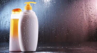Different containers of body care products in the bathroom