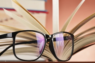 Composition with glasses and books on the table