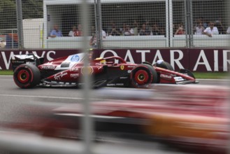 MELBOURNE, AUSTRALIA - MARCH 15: Lewis Hamilton of Great Britain spins the Scuderia Ferrari HP