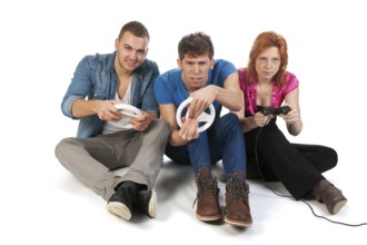 Three young friends ar gaming with the computer
