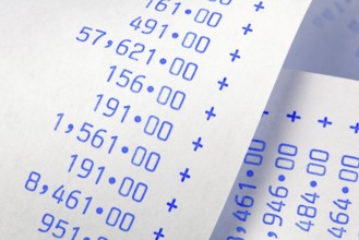 Calculation strip with numbers. Symbol for costs, expenses, turnover and profit. / Computing