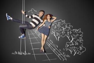 Happy Valentine's Day love story concept of a romantic couple against chalk drawings background.