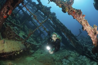 Divers on the wreck of the Umbria, Wingate Reef, Red Sea, Sudan, Africa