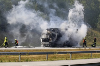 SALO, FINLAND, AUGUST 17, 2018: Firefighters extinguish vehicle fire on E18 in Salo. Delivery truck